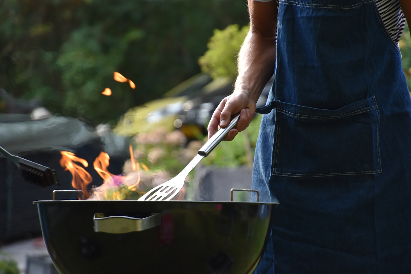 An African chef preparing a meal over an open fire
